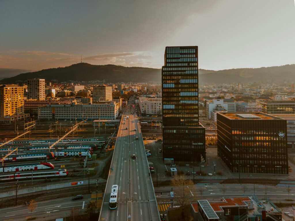 Photo by Patrick Federi cars on road near city buildings during daytime
